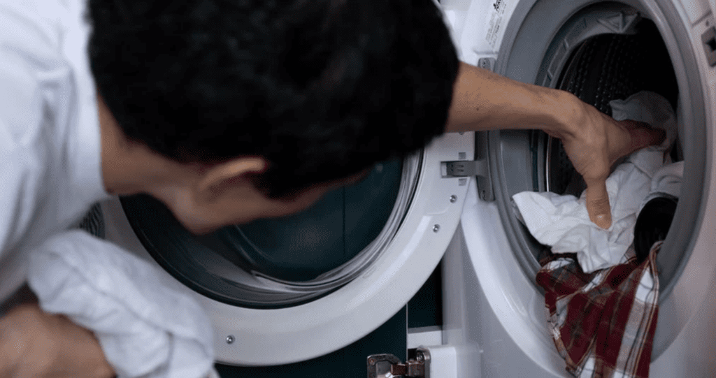 a guy learning How to Wash Vintage Clothes
